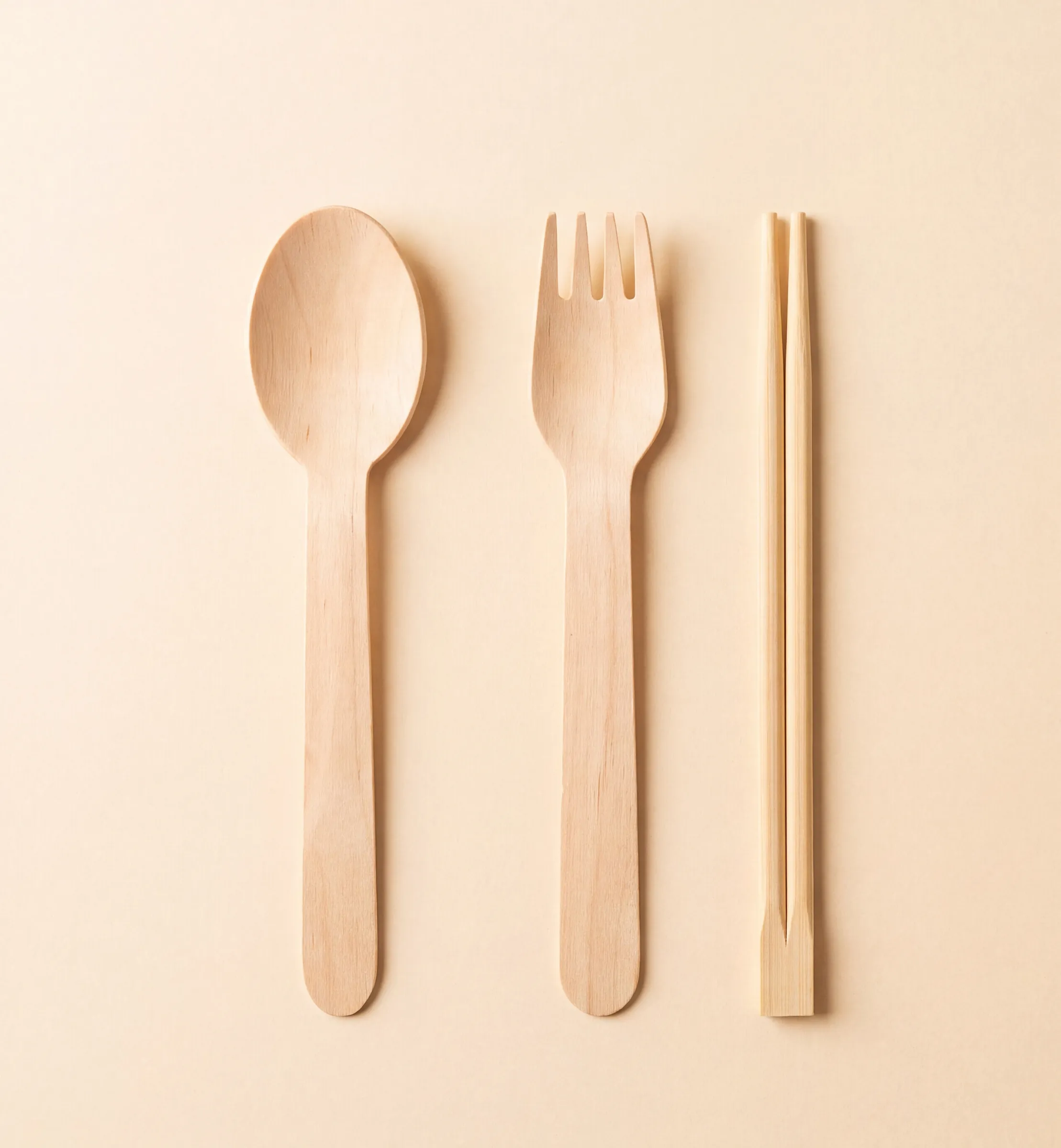 A wooden spoon, fork and chopsticks